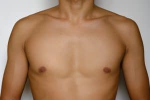 Man has flat masculine chest to better show off his proportions.
