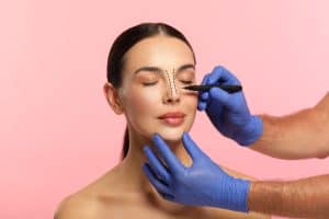 Woman meets with surgeon for a rhinoplasty consultation.