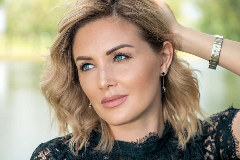 Middle aged woman has gorgeous face thanks to combination of cosmetic treatments.