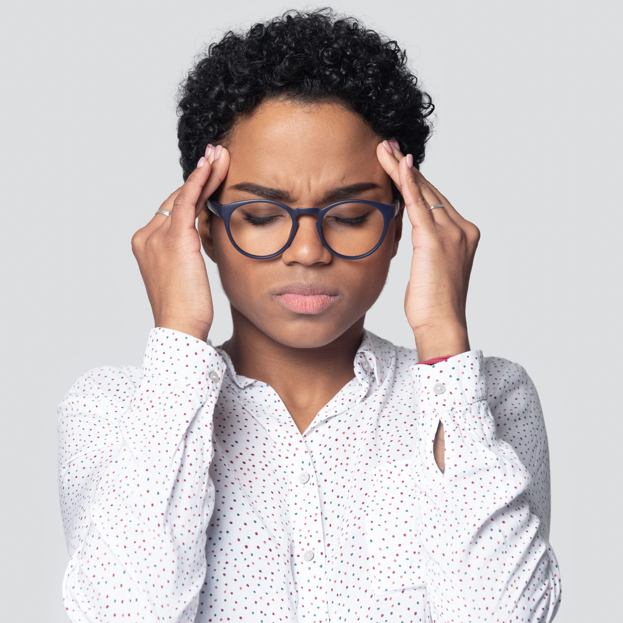 Person with glasses deep in thought due to some cognitive decline