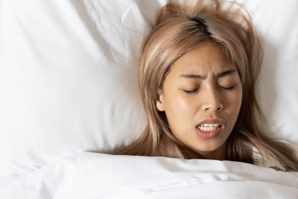 NYC woman grinds her teeth in her sleep.