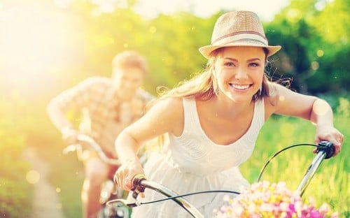 Girl smiling riding her bike