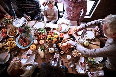 Family sitting around the Thanksgiving table