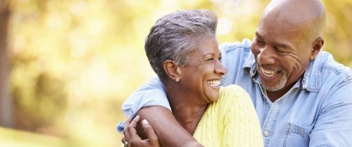 elderly couple with healthy smiles