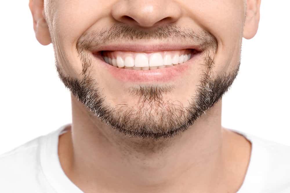 Man with healthy smile after implants in Seattle, WA